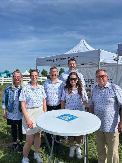 Team in matching custom polos at an outdoor community event