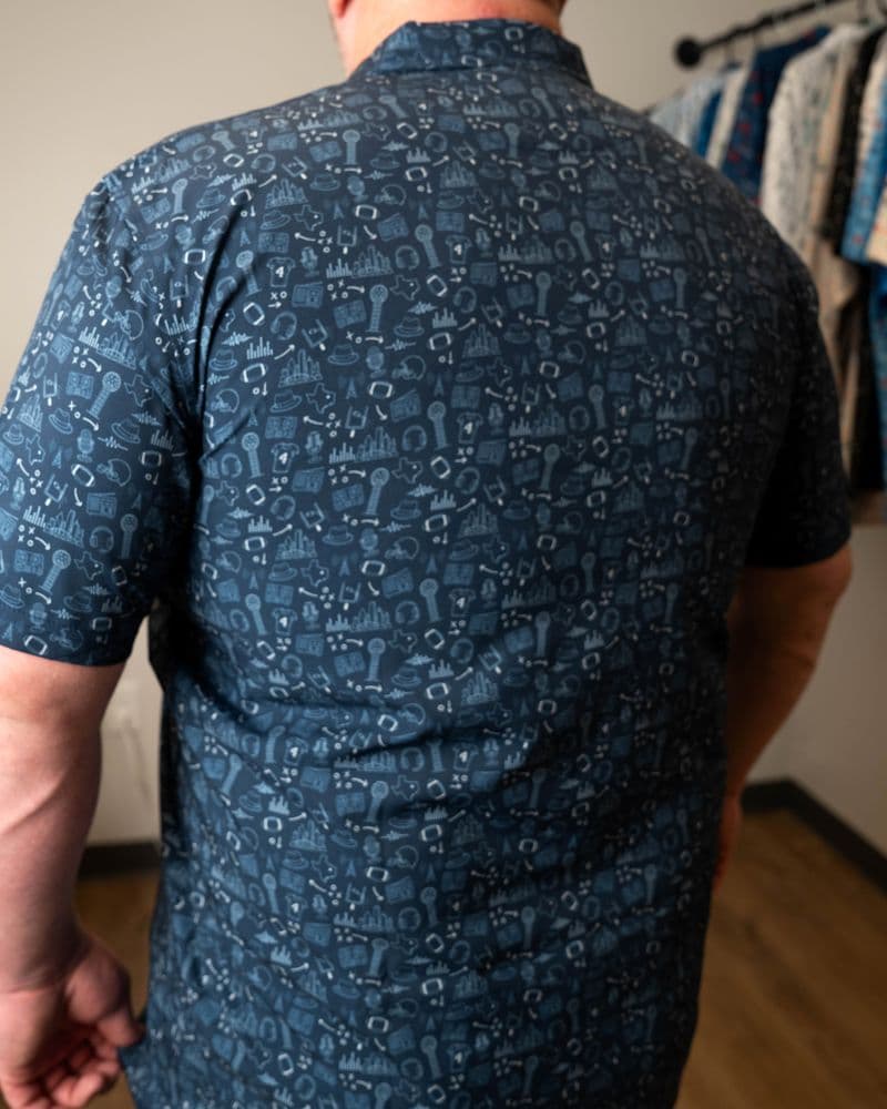 Back of the navy button-up, print across the back and short sleeve.