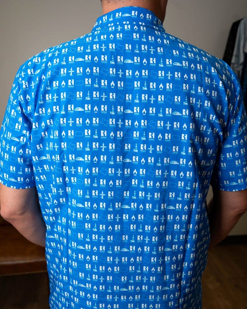 Back of the royal blue button-up, print across the back and short sleeves.