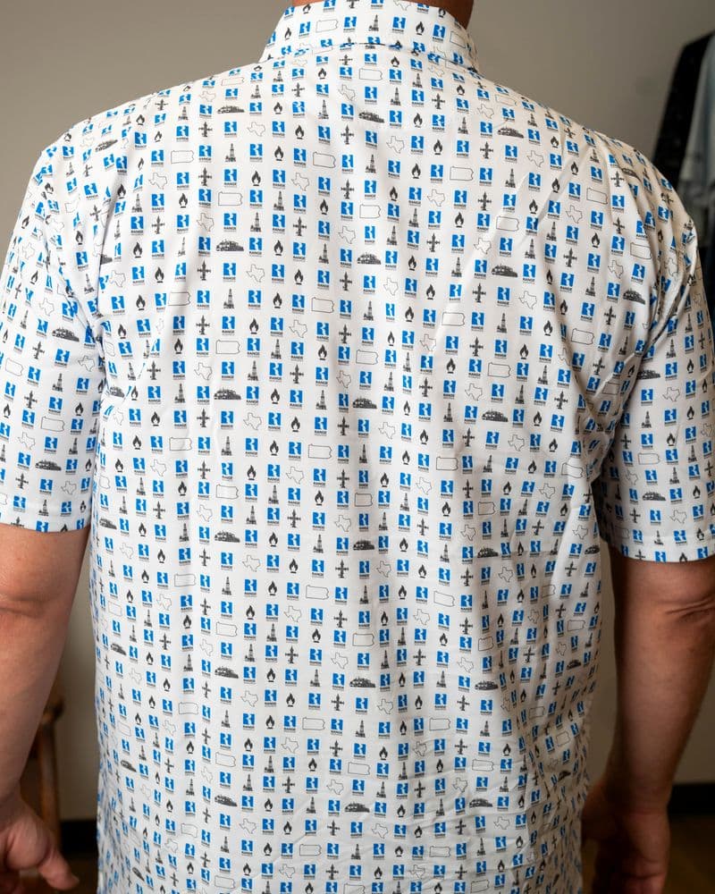 Back of the white button-up, print across the back and short sleeves.